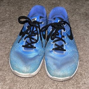 Worn Nike women’s metcon sneakers
